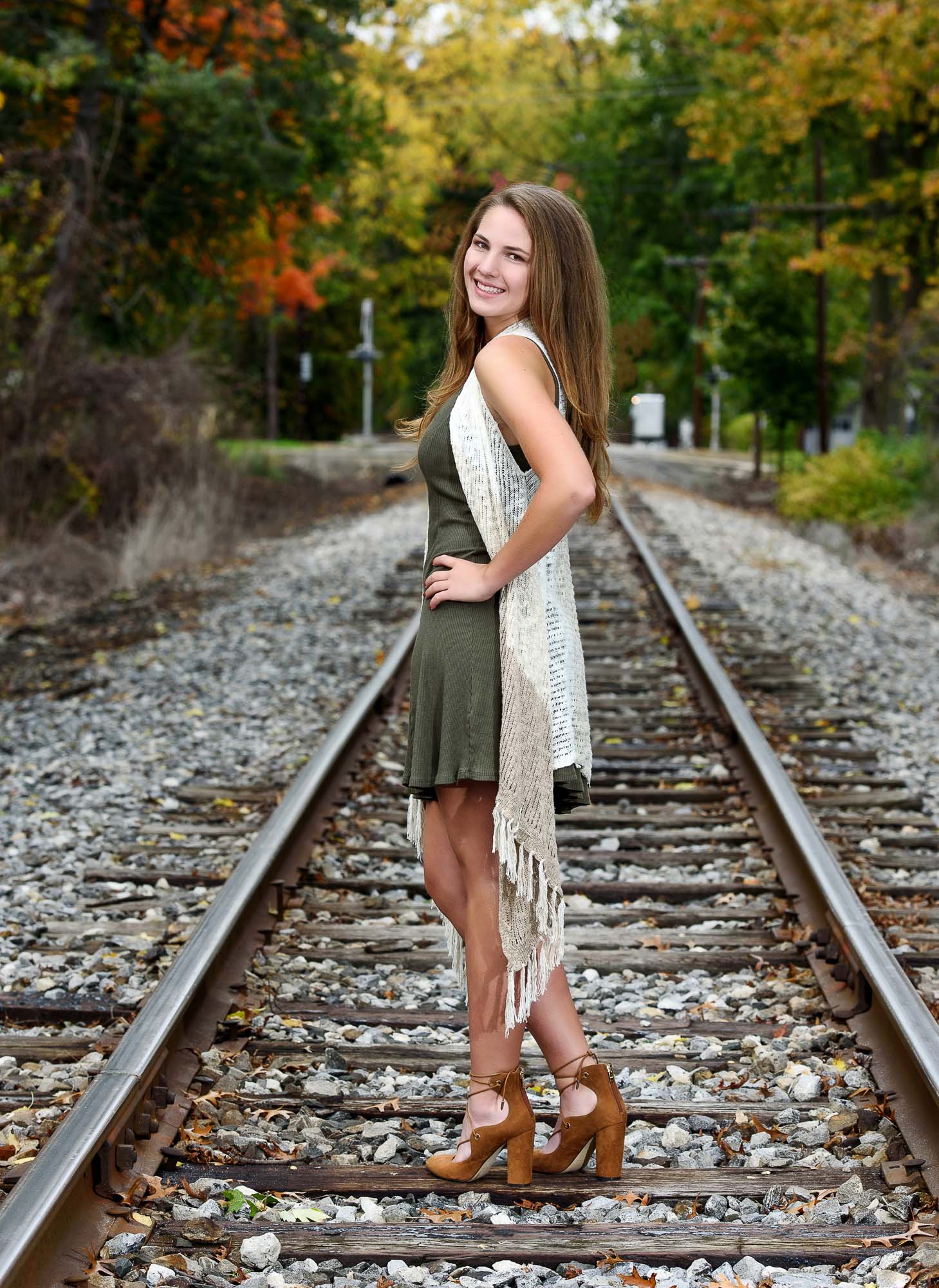 Senior posed on railroad tracks in Sylvania